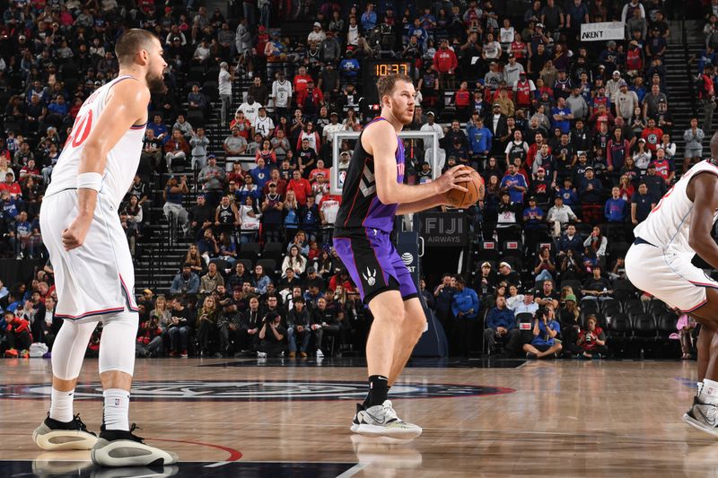 INGLEWOOD, CA - NOVEMBER 9: Jakob Poeltl #19 of the Toronto Raptors handles the ball during the game against the LA Clippers on November 9, 2024 at Intuit Dome in Los Angeles, California. NOTE TO USER: User expressly acknowledges and agrees that, by downloading and/or using this Photograph, user is consenting to the terms and conditions of the Getty Images License Agreement. Mandatory Copyright Notice: Copyright 2024 NBAE (Photo by Noah Graham/NBAE via Getty Images)