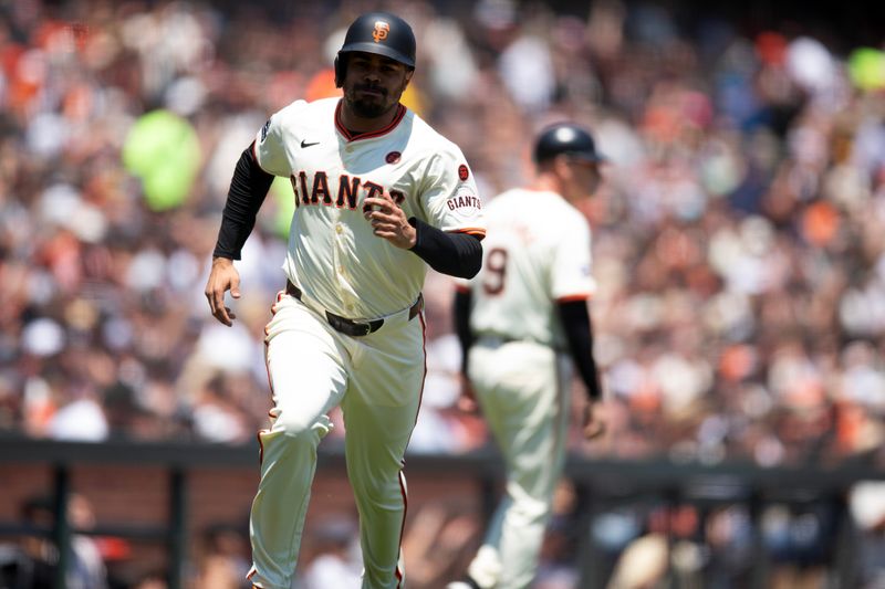 Jul 14, 2024; San Francisco, California, USA; San Francisco Giants first baseman LaMonte Wade Jr. (31) scores on a single by Patrick Bailey during the third inning against the Minnesota Twins at Oracle Park. Mandatory Credit: D. Ross Cameron-USA TODAY Sports