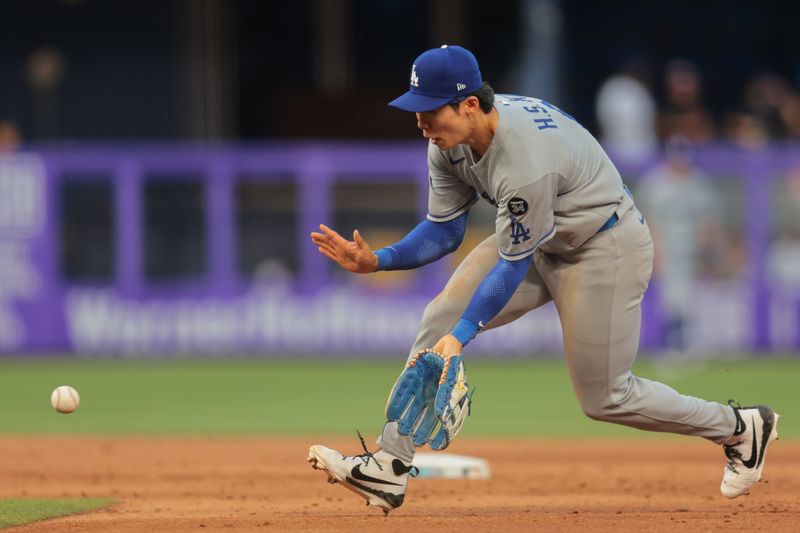 May 5, 2025; Miami, Florida, USA; Los Angeles Dodgers second baseman Hyeseong Kim (6) catches a ground ball but cannot throw out Miami Marlins second baseman Ronny Simon (not pictured) during the ninth inning at loanDepot Park. Mandatory Credit: Sam Navarro-Imagn Images