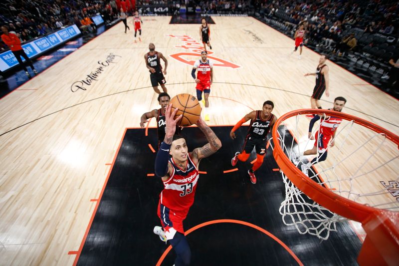 DETROIT, MI - JANUARY 27: Kyle Kuzma #33 of the Washington Wizards drives to the basket during the game against the Detroit Pistons on January 27, 2024 at Little Caesars Arena in Detroit, Michigan. NOTE TO USER: User expressly acknowledges and agrees that, by downloading and/or using this photograph, User is consenting to the terms and conditions of the Getty Images License Agreement. Mandatory Copyright Notice: Copyright 2024 NBAE (Photo by Brian Sevald/NBAE via Getty Images)