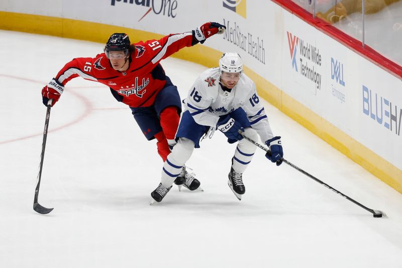 Oct 24, 2023; Washington, District of Columbia, USA; Toronto Maple Leafs center Noah Gregor (18) skates with the puck as Washington Capitals left wing Sonny Milano (15) chases in the first period at Capital One Arena. Mandatory Credit: Geoff Burke-USA TODAY Sports