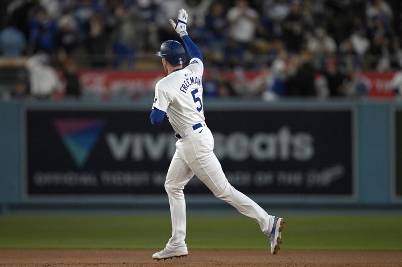 May 20, 2024; Los Angeles, California, USA;  Los Angeles Dodgers first baseman Freddie Freeman (5) rounds the bases after hitting a grand slam home run in the third inning against the Arizona Diamondbacks at Dodger Stadium. Mandatory Credit: Jayne Kamin-Oncea-USA TODAY Sports