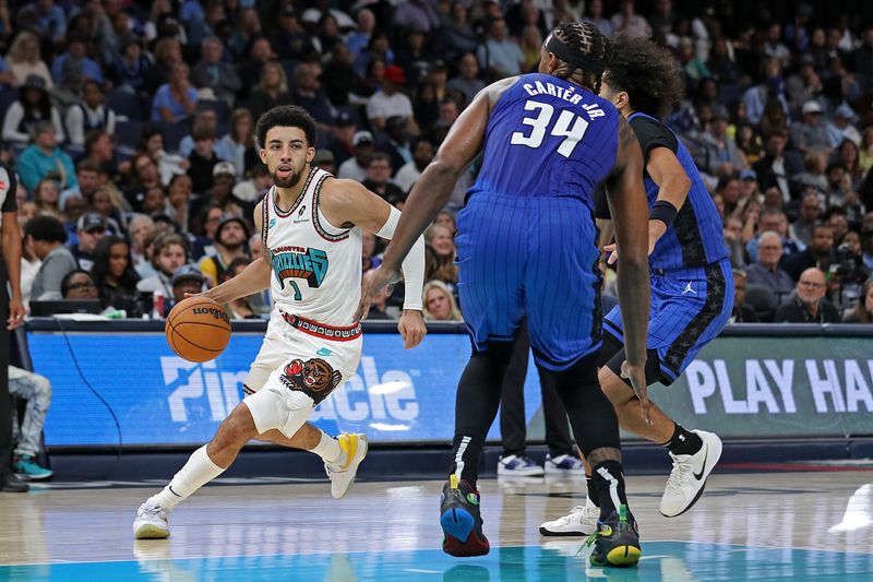 MEMPHIS, TENNESSEE - OCTOBER 26: Scotty Pippen Jr. #1 of the Memphis Grizzlies drives to the basket against Wendell Carter Jr. #34 of the Orlando Magic during the second half at FedExForum on October 26, 2024 in Memphis, Tennessee. NOTE TO USER: User expressly acknowledges and agrees that, by downloading and or using this photograph, User is consenting to the terms and conditions of the Getty Images License Agreement. (Photo by Justin Ford/Getty Images)