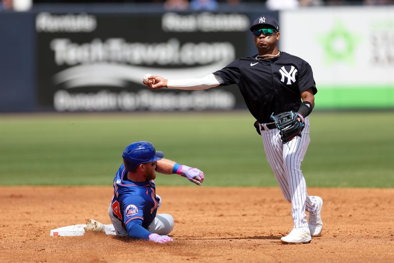 Mar 25, 2024; Tampa, Florida, USA;  New York Yankees shortstop Rodrick Arias (18) attempts to turn a double play against the New York Mets in the third inning at George M. Steinbrenner Field. Mandatory Credit: Nathan Ray Seebeck-USA TODAY Sports