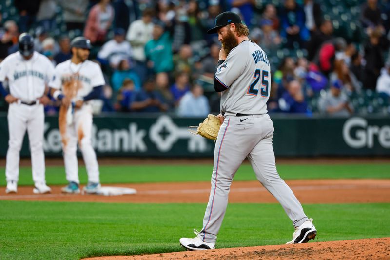 Jun 13, 2023; Seattle, Washington, USA; Miami Marlins relief pitcher Archie Bradley (25) walks to the dugout after being relieved for against the Seattle Mariners during the sixth inning at T-Mobile Park. Mandatory Credit: Joe Nicholson-USA TODAY Sports