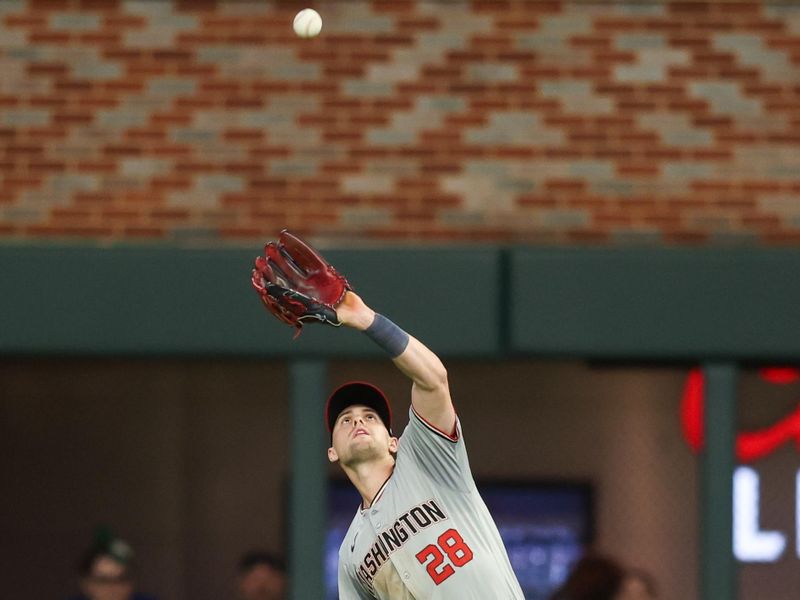 May 30, 2024; Atlanta, Georgia, USA; Washington Nationals right fielder Lane Thomas (28) catches a fly ball against the Atlanta Braves in the ninth inning at Truist Park. Mandatory Credit: Brett Davis-USA TODAY Sports