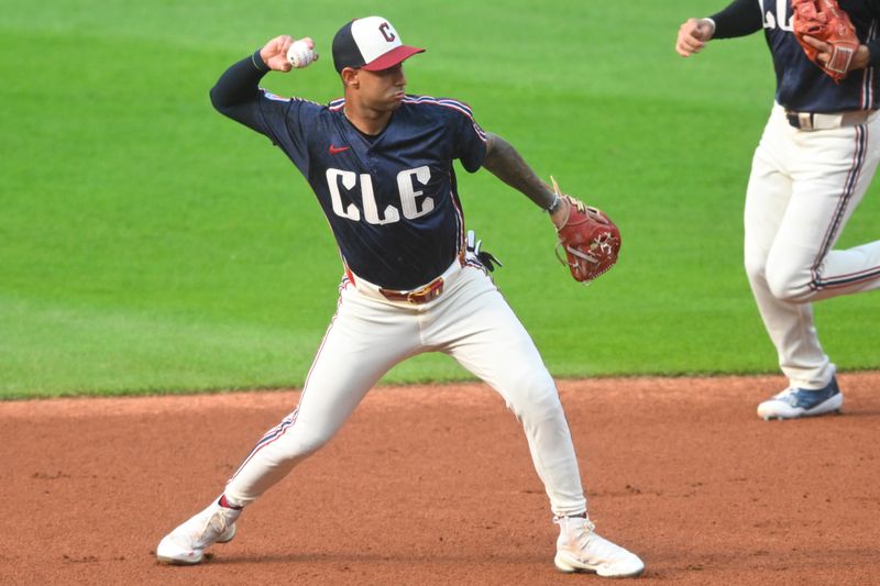 Jun 18, 2024; Cleveland, Ohio, USA; Cleveland Guardians shortstop Brayan Rocchio (4) throws to first base in the first inning against the Seattle Mariners at Progressive Field. Mandatory Credit: David Richard-USA TODAY Sports