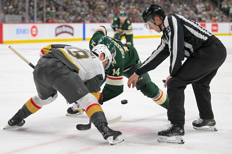 May 1, 2025; Saint Paul, Minnesota, USA;  Vegas Golden Knights forward Jack Eichel (9) and Minnesota Wild forward Joel Eriksson Ek (14) face-off during the second period in game six of the first round of the 2025 Stanley Cup Playoffs at Xcel Energy Center. Mandatory Credit: Nick Wosika-Imagn Images