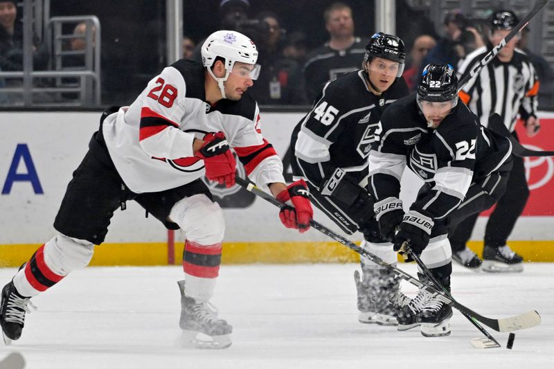 Mar 3, 2024; Los Angeles, California, USA;  New Jersey Devils right wing Timo Meier (28) and Los Angeles Kings left wing Kevin Fiala (22) battle for the puck in the first period at Crypto.com Arena. Mandatory Credit: Jayne Kamin-Oncea-USA TODAY Sports