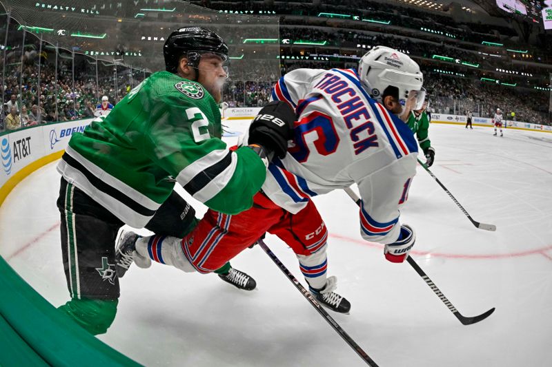 Nov 20, 2023; Dallas, Texas, USA; Dallas Stars defenseman Jani Hakanpaa (2) checks New York Rangers center Vincent Trocheck (16) during the first period at the American Airlines Center. Mandatory Credit: Jerome Miron-USA TODAY Sports