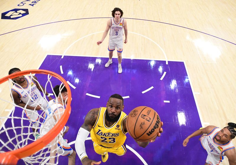 LOS ANGELES, CA - MARCH 4: LeBron James #23 of the Los Angeles Lakers drives to the basket during the game against the Oklahoma City Thunder on March 4, 2024 at Crypto.Com Arena in Los Angeles, California. NOTE TO USER: User expressly acknowledges and agrees that, by downloading and/or using this Photograph, user is consenting to the terms and conditions of the Getty Images License Agreement. Mandatory Copyright Notice: Copyright 2024 NBAE (Photo by Adam Pantozzi/NBAE via Getty Images)