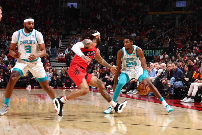 TORONTO, CANADA - MARCH 3: Brandon Miller #24 of the Charlotte Hornets dribbles the ball during the game against the Toronto Raptors on March 3, 2024 at the Scotiabank Arena in Toronto, Ontario, Canada.  NOTE TO USER: User expressly acknowledges and agrees that, by downloading and or using this Photograph, user is consenting to the terms and conditions of the Getty Images License Agreement.  Mandatory Copyright Notice: Copyright 2024 NBAE (Photo by Vaughn Ridley/NBAE via Getty Images)