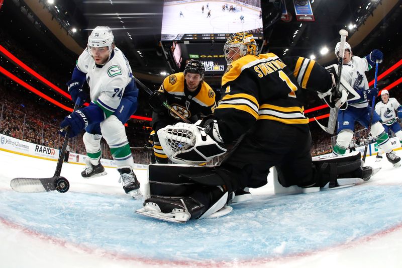 Nov 26, 2024; Boston, Massachusetts, USA; Vancouver Canucks left wing Jake DeBrusk (74) scores on Boston Bruins goaltender Jeremy Swayman (1) during the second period at TD Garden. Mandatory Credit: Winslow Townson-Imagn Images