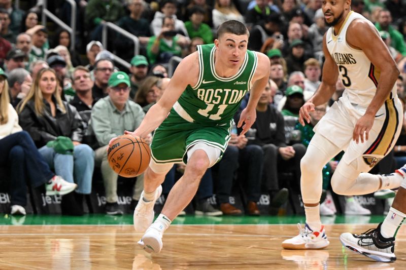 BOSTON, MASSACHUSETTS - JANUARY 12: Payton Pritchard #11 of the Boston Celtics drives to the basket against the New Orleans Pelicans during the first quarter at the TD Garden on January 12, 2025 in Boston, Massachusetts. NOTE TO USER: User expressly acknowledges and agrees that, by downloading and or using this photograph, User is consenting to the terms and conditions of the Getty Images License Agreement. (Photo by Brian Fluharty/Getty Images)