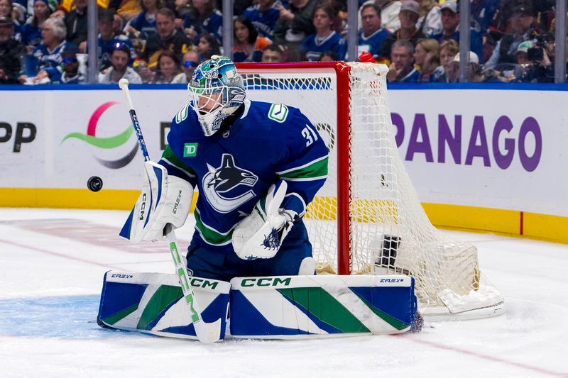 May 20, 2024; Vancouver, British Columbia, CAN; Vancouver Canucks goalie Arturs Silvos (31) makes a save against the Edmonton Oilers during the second period in game seven of the second round of the 2024 Stanley Cup Playoffs at Rogers Arena. Mandatory Credit: Bob Frid-USA TODAY Sports