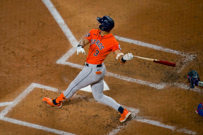 Oct 18, 2023; Arlington, Texas, USA; Houston Astros shortstop Jeremy Pena (3) bats against the Texas Rangers during the second inning during game three of the ALCS for the 2023 MLB playoffs at Globe Life Field. Mandatory Credit: Jerome Miron-USA TODAY Sports