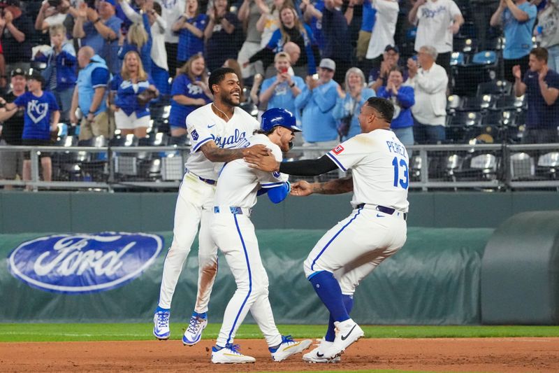 May 6, 2025; Kansas City, Missouri, USA; Kansas City Royals shortstop Bobby Witt Jr. (7) celebrates with second base Maikel Garcia (11) and designated hitter Salvador Perez (13) after a walk-off win over the Chicago White Sox at Kauffman Stadium. Mandatory Credit: Denny Medley-Imagn Images