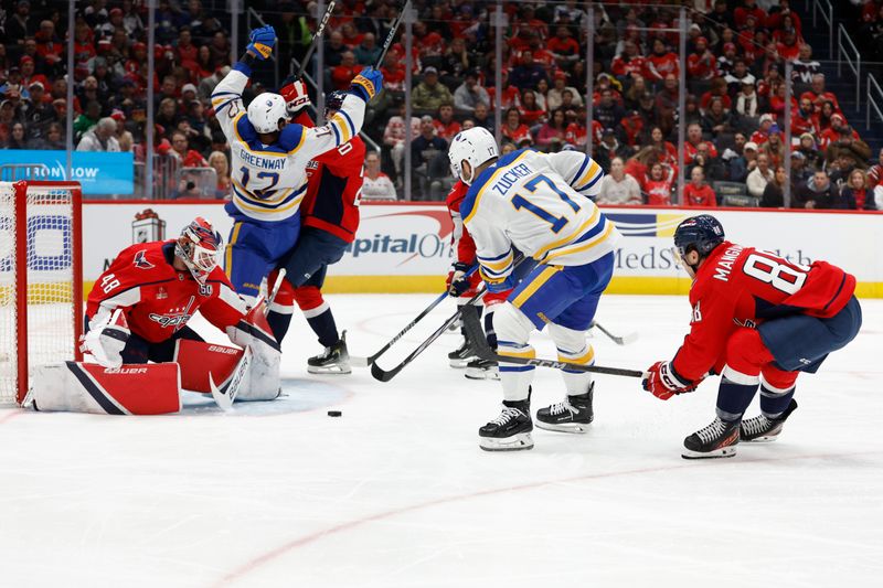 Dec 14, 2024; Washington, District of Columbia, USA; Buffalo Sabres left wing Jason Zucker (17) shoots the puck on Washington Capitals goaltender Logan Thompson (48) in the second period at Capital One Arena. Mandatory Credit: Geoff Burke-Imagn Images