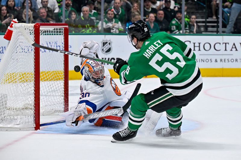 Feb 26, 2024; Dallas, Texas, USA; New York Islanders goaltender Ilya Sorokin (30) stops a shot by Dallas Stars defenseman Thomas Harley (55) during the second period at the American Airlines Center. Mandatory Credit: Jerome Miron-USA TODAY Sports