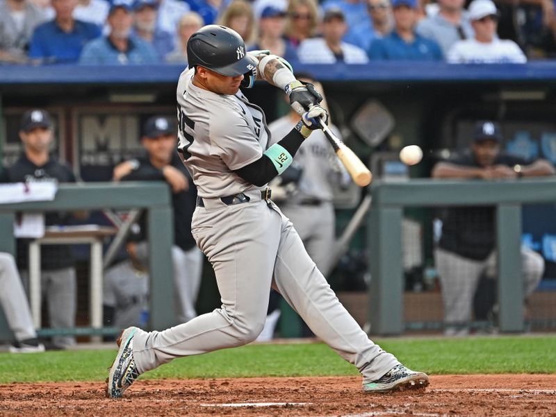 Jun 11, 2024; Kansas City, Missouri, USA; New York Yankees right fielder Juan Soto (22) singles in the fourth inning against the Kansas City Royals at Kauffman Stadium. Mandatory Credit: Peter Aiken-USA TODAY Sports