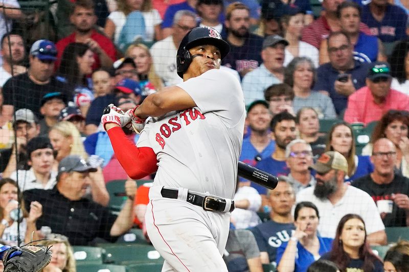 Jul 14, 2023; Chicago, Illinois, USA; Boston Red Sox third baseman Rafael Devers (11) hits a home run against the Chicago Cubs during the third inning at Wrigley Field. Mandatory Credit: David Banks-USA TODAY Sports