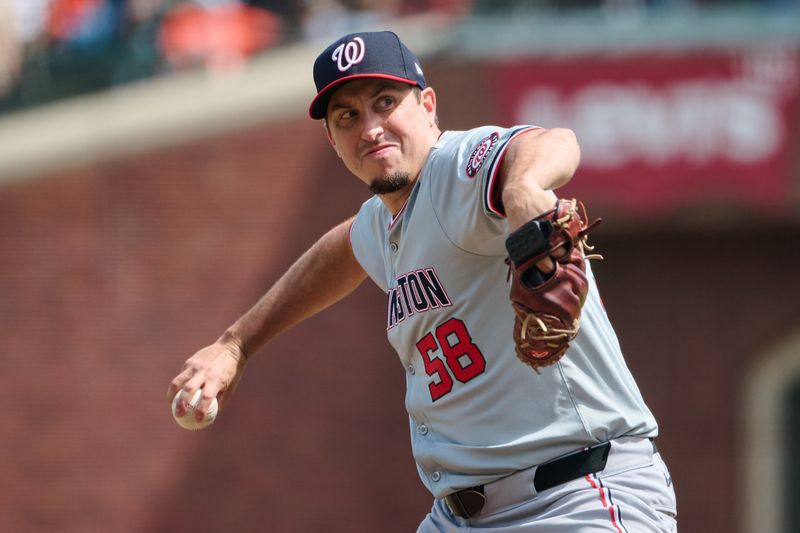 Apr 10, 2024; San Francisco, California, USA; Washington Nationals pitcher Derek Law (58) throws a pitch against the San Francisco Giants during the sixth inning at Oracle Park. Mandatory Credit: Robert Edwards-USA TODAY Sports