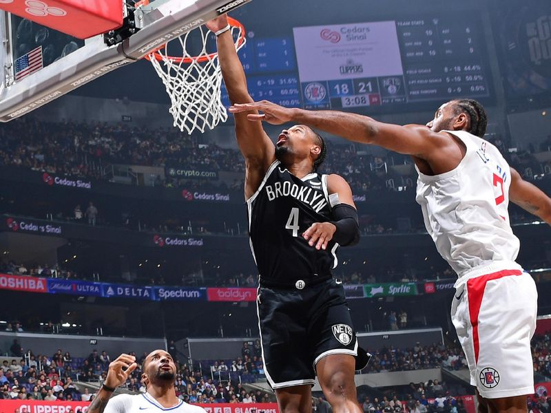 LOS ANGELES, CA - JANUARY 21: Dennis Smith Jr. #4 of the Brooklyn Nets drives to the basket during the game against the LA Clippers on January 21, 2024 at Crypto.Com Arena in Los Angeles, California. NOTE TO USER: User expressly acknowledges and agrees that, by downloading and/or using this Photograph, user is consenting to the terms and conditions of the Getty Images License Agreement. Mandatory Copyright Notice: Copyright 2024 NBAE (Photo by Adam Pantozzi/NBAE via Getty Images)