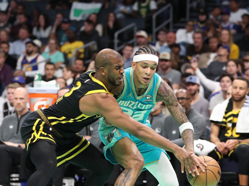 CHARLOTTE, NC - MARCH 29:  Chris Paul #3 of the Golden State Warriors plays defense against Tre Mann #23 of the Charlotte Hornets on March 29, 2024 at Spectrum Center in Charlotte, North Carolina. NOTE TO USER: User expressly acknowledges and agrees that, by downloading and or using this photograph, User is consenting to the terms and conditions of the Getty Images License Agreement.  Mandatory Copyright Notice:  Copyright 2024 NBAE (Photo by Brock Williams-Smith/NBAE via Getty Images)