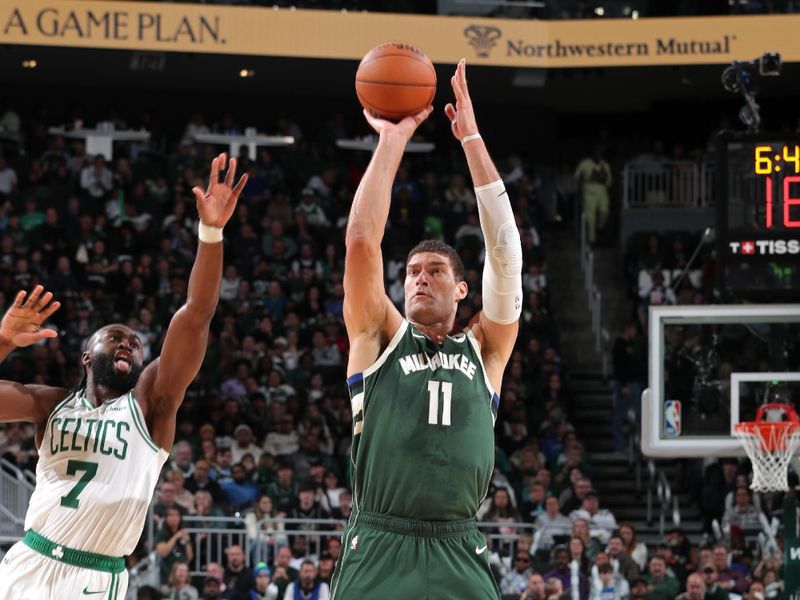 MILWAUKEE, WI - NOVEMBER 10: Brook Lopez #11 of the Milwaukee Bucks three point basket during the game against the Boston Celtics on November 10, 2024 at the Fiserv Forum Center in Milwaukee, Wisconsin. NOTE TO USER: User expressly acknowledges and agrees that, by downloading and or using this Photograph, user is consenting to the terms and conditions of the Getty Images License Agreement. Mandatory Copyright Notice: Copyright 2024 NBAE (Photo by Gary Dineen/NBAE via Getty Images).