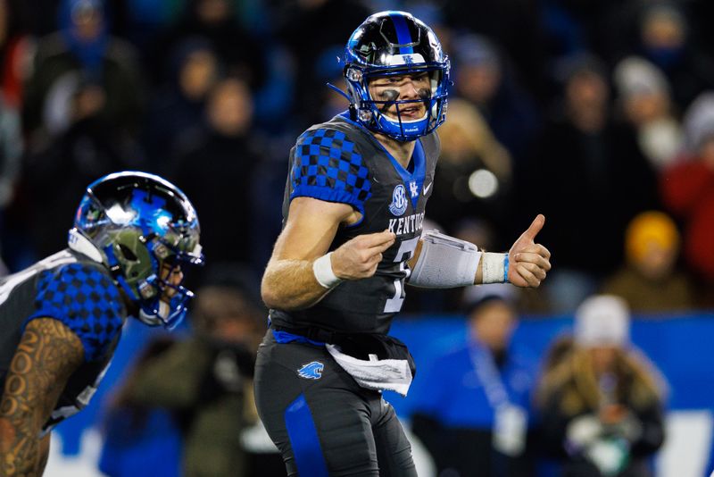 Nov 19, 2022; Lexington, Kentucky, USA; Kentucky Wildcats quarterback Will Levis (7) motions to his teammates during the fourth quarter against the Georgia Bulldogs at Kroger Field. Mandatory Credit: Jordan Prather-USA TODAY Sports