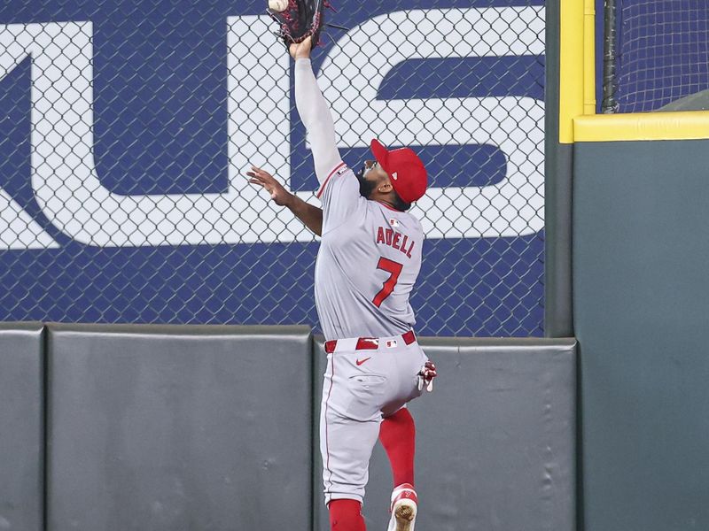 May 22, 2024; Houston, Texas, USA; Los Angeles Angels right fielder Jo Adell (7) is unable to catch a fly ball from Houston Astros catcher Victor Caratini (not pictured) during the third inning at Minute Maid Park. Mandatory Credit: Troy Taormina-USA TODAY Sports