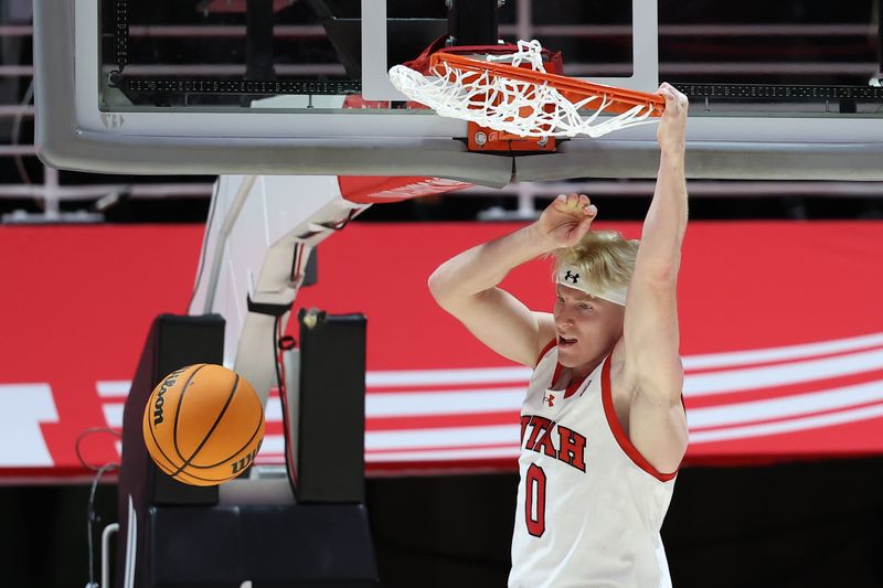 Dec 5, 2023; Salt Lake City, Utah, USA; Utah Utes guard Hunter Erickson (0) dunks the ball against the Southern Utah Thunderbirds during the first half at Jon M. Huntsman Center. Mandatory Credit: Rob Gray-USA TODAY Sports