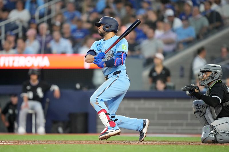 May 22, 2024; Toronto, Ontario, CAN; Toronto Blue Jays third baseman Isiah Kiner-Falefa (7) hits a single against the Chicago White Sox during the fifth inning at Rogers Centre. Mandatory Credit: John E. Sokolowski-USA TODAY Sports