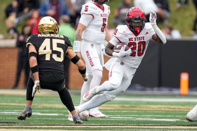 Nov 11, 2023; Winston-Salem, North Carolina, USA; North Carolina State Wolfpack running back Kendrick Raphael (20) cuts away from Wake Forest Demon Deacons defensive back Nick Andersen (45) during the first half at Allegacy Federal Credit Union Stadium. Mandatory Credit: Jim Dedmon-USA TODAY Sports