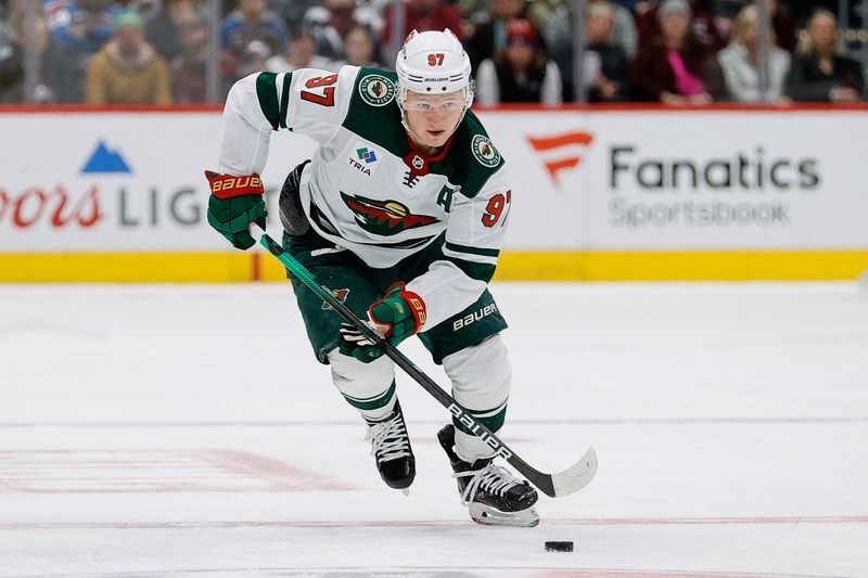 Mar 8, 2024; Denver, Colorado, USA; Minnesota Wild left wing Kirill Kaprizov (97) controls the puck in the third period against the Colorado Avalanche at Ball Arena. Mandatory Credit: Isaiah J. Downing-USA TODAY Sports