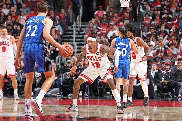 CHICAGO, IL - NOVEMBER 15: Torrey Craig #13 of Chicago Bulls plays defense against the Orlando Magic on November 15, 2023 at United Center in Chicago, Illinois. NOTE TO USER: User expressly acknowledges and agrees that, by downloading and or using this photograph, User is consenting to the terms and conditions of the Getty Images License Agreement. Mandatory Copyright Notice: Copyright 2023 NBAE (Photo by Jeff Haynes/NBAE via Getty Images)