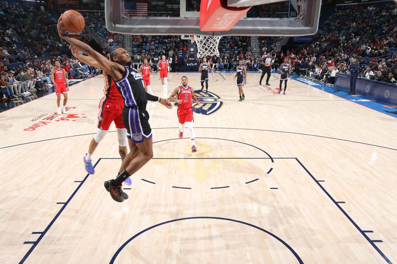 NEW ORLEANS, LA - DECEMBER 12: Issac Jones #17 of the Sacramento Kings dunks the ball during the game against the New Orleans Pelicans on December 12, 2024 at the Smoothie King Center in New Orleans, Louisiana. NOTE TO USER: User expressly acknowledges and agrees that, by downloading and or using this Photograph, user is consenting to the terms and conditions of the Getty Images License Agreement. Mandatory Copyright Notice: Copyright 2024 NBAE (Photo by Layne Murdoch Jr./NBAE via Getty Images)