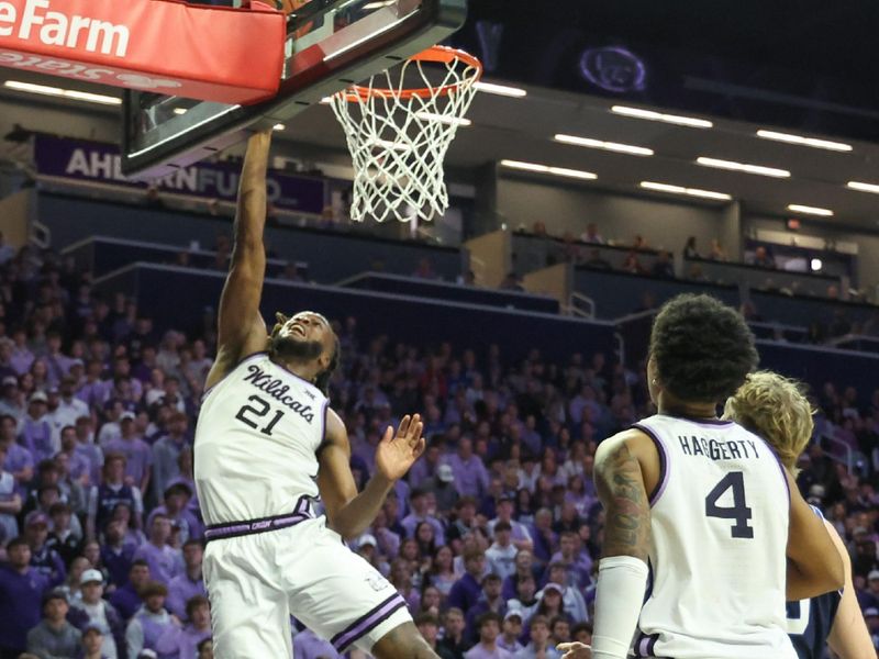 Jan 3, 2026; Manhattan, Kansas, USA; Kansas State Wildcats forward Khamari McGriff (21) makes a layup during the second half Brigham Young Cougars at Bramlage Coliseum. Mandatory Credit: Scott Sewell-Imagn Images