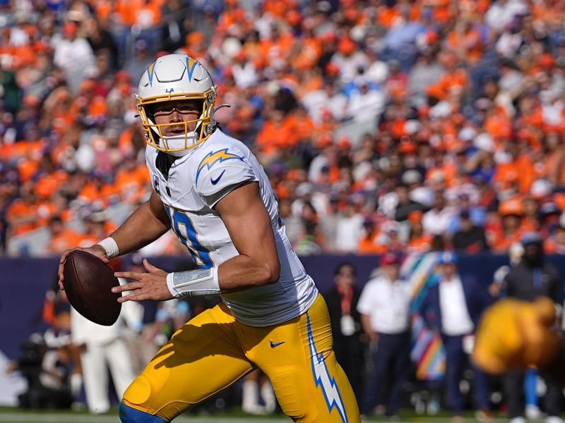 Los Angeles Chargers quarterback Justin Herbert (10) looks to pass during the first half of an NFL football game against the Denver Broncos, Sunday, Oct. 13, 2024, in Denver. (AP Photo/David Zalubowski)