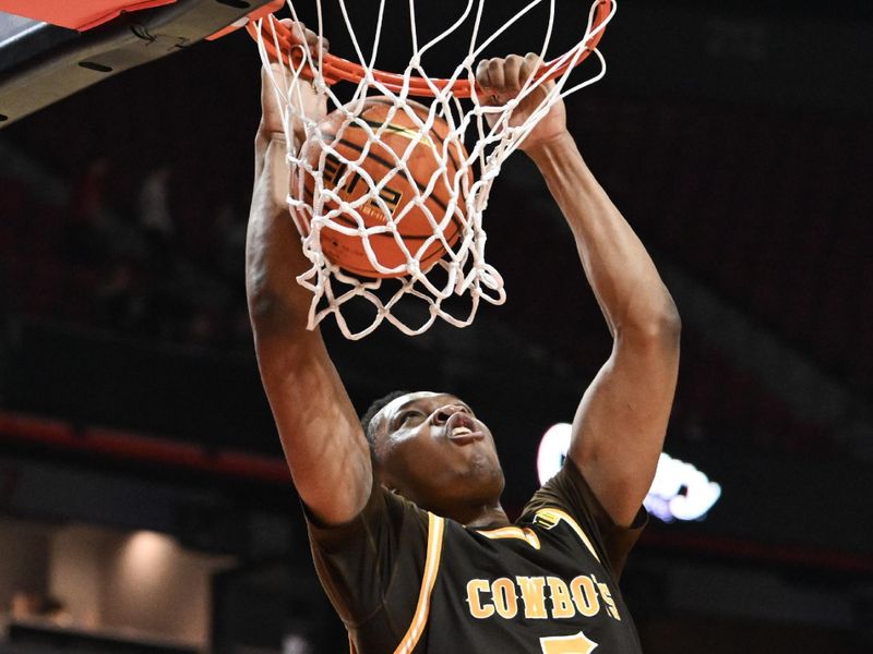 Feb 3, 2024; Las Vegas, Nevada, USA; Wyoming Cowboys forward Cam Manyawu (5) dunks the ball against the Wyoming Cowboys in the second half at Thomas & Mack Center. Mandatory Credit: Candice Ward-USA TODAY Sports