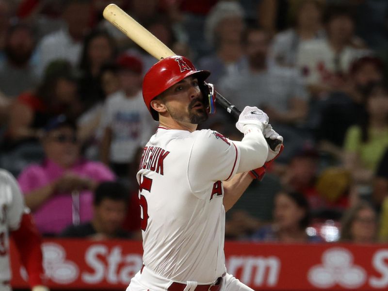 Sep 9, 2023; Anaheim, California, USA;  Los Angeles Angels left fielder Randal Grichuk (15) hits a two-run home run during the eighth inning against the Cleveland Guardians at Angel Stadium. Mandatory Credit: Kiyoshi Mio-USA TODAY Sports