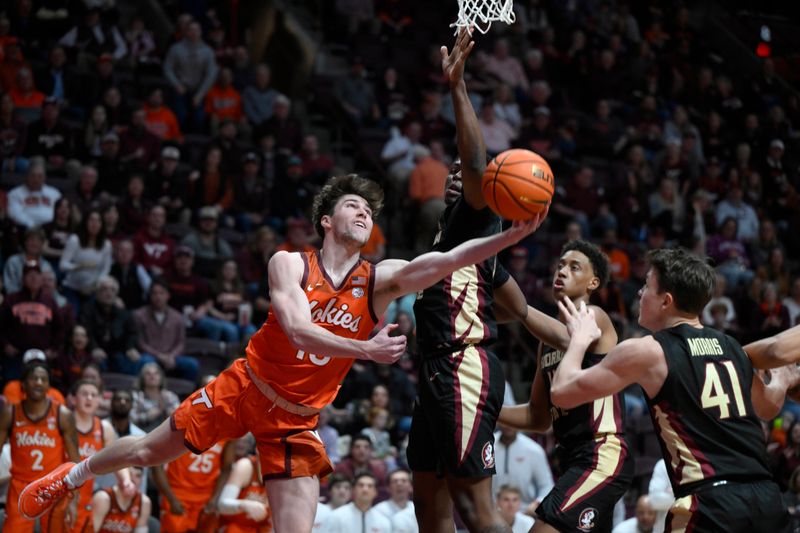 Mar 4, 2023; Blacksburg, Virginia, USA; Virginia Tech Hokies guard Camden Johnson (10) drives under the basket against the Florida State Seminoles in the second half at Cassell Coliseum. Mandatory Credit: Lee Luther Jr.-USA TODAY Sports