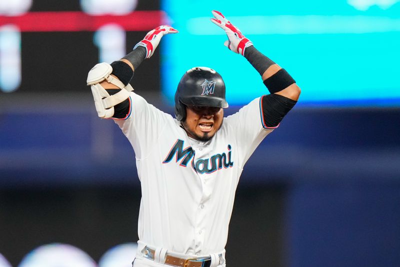 Jul 23, 2023; Miami, Florida, USA; Miami Marlins second baseman Luis Arraez (3) celebrates hitting a double against the Colorado Rockies during the sixth inning at loanDepot Park. Mandatory Credit: Rich Storry-USA TODAY Sports