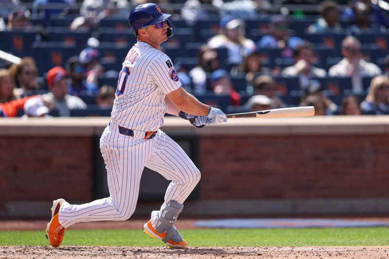 Apr 20, 2025; New York City, New York, USA; New York Mets first baseman Pete Alonso (20) hits an RBI single during the fifth inning against the St. Louis Cardinals at Citi Field. Mandatory Credit: Vincent Carchietta-Imagn Images