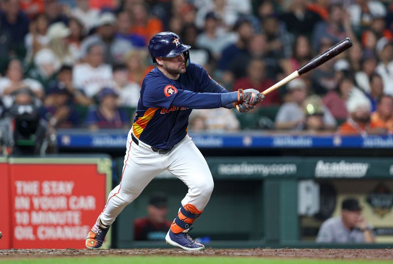 Sep 8, 2024; Houston, Texas, USA; Houston Astros center fielder Chas McCormick (20) hits a single during the fifth inning against the Arizona Diamondbacks at Minute Maid Park. Mandatory Credit: Troy Taormina-Imagn Images