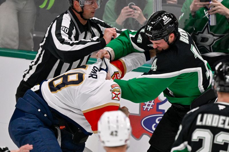 Dec 13, 2025; Dallas, Texas, USA; Dallas Stars left wing Jamie Benn (14) fights with Florida Panthers left wing Noah Gregor (18) during the second period at the American Airlines Center. Mandatory Credit: Jerome Miron-Imagn Images