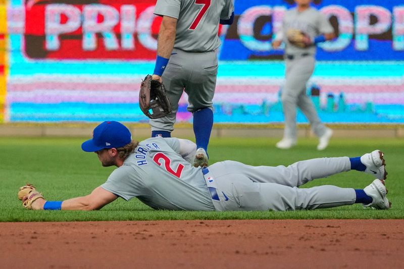 Jul 26, 2024; Kansas City, Missouri, USA; Chicago Cubs second baseman Nico Hoerner (2) makes a leaping catch for an out against the Kansas City Royals in the first inning at Kauffman Stadium. Mandatory Credit: Denny Medley-USA TODAY Sports