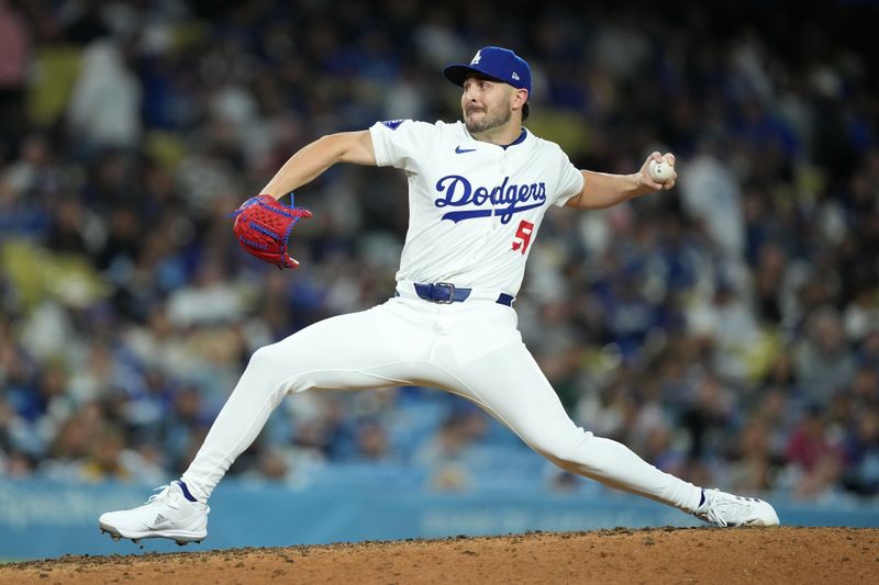 Apr 12, 2024; Los Angeles, California, USA; Los Angeles Dodgers pitcher Alex Vesia (51) throws in the 11th inning against the San Diego Padres at Dodger Stadium. Mandatory Credit: Kirby Lee-USA TODAY Sports