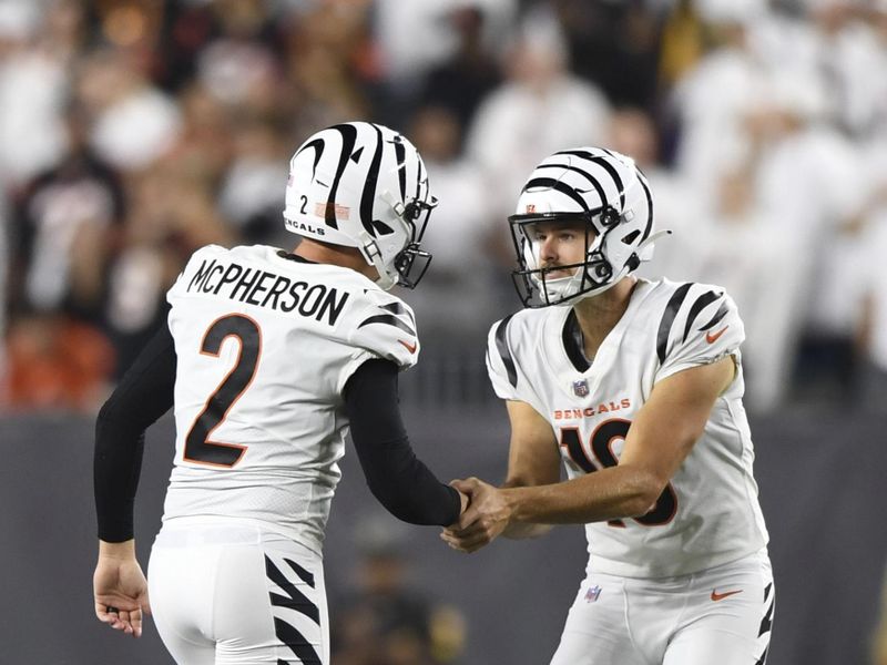 Cincinnati Bengals place kicker Evan McPherson (2) celebrates his field goal with punter Brad Robbins (10) during an NFL football game against the Los Angeles Rams on Monday, Sept. 25, 2023, in Cincinnati. (AP Photo/Emilee Chinn)