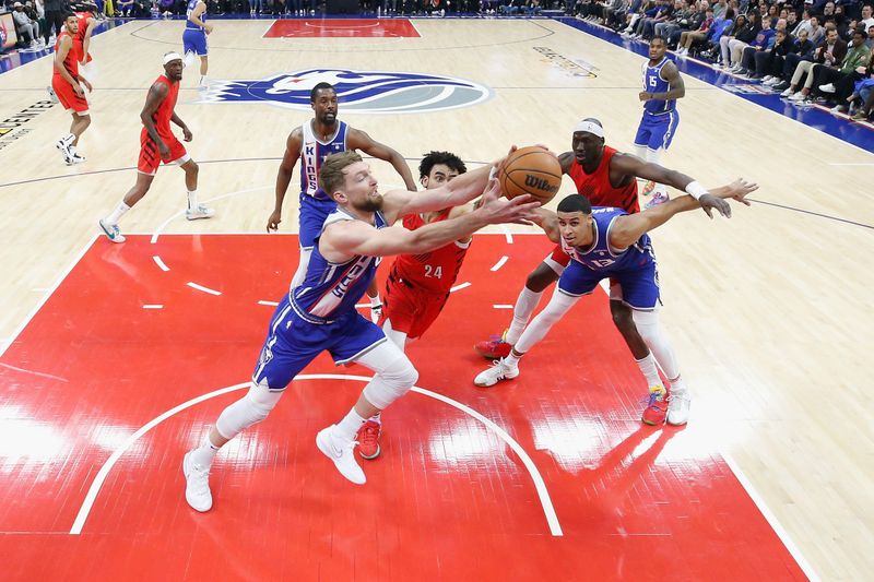 SACRAMENTO, CALIFORNIA - APRIL 14: Domantas Sabonis #10 of the Sacramento Kings competes for a loose ball against Justin Minaya #24 of the Portland Trail Blazers in the first quarter at Golden 1 Center on April 14, 2024 in Sacramento, California. NOTE TO USER: User expressly acknowledges and agrees that, by downloading and or using this photograph, User is consenting to the terms and conditions of the Getty Images License Agreement. (Photo by Lachlan Cunningham/Getty Images)